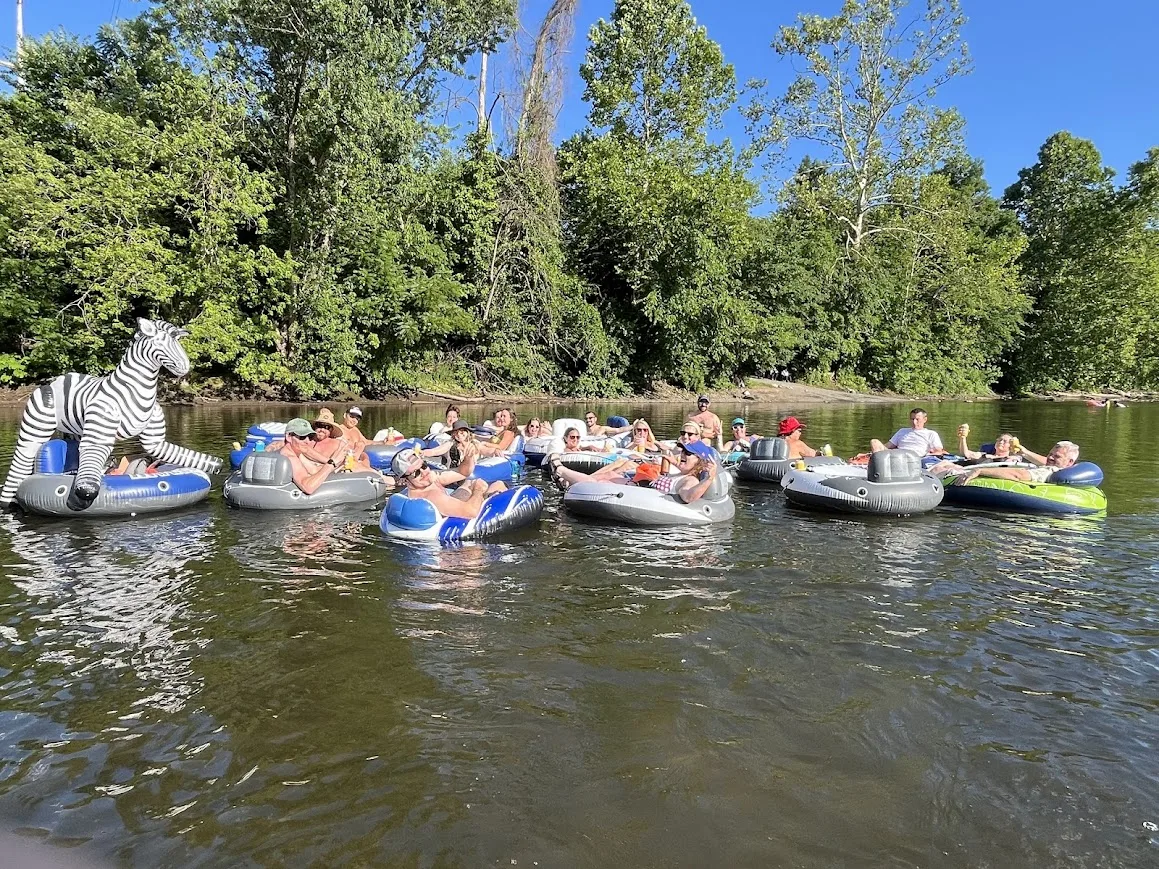 Flotilla of tubers linked together with the inflatable zebra